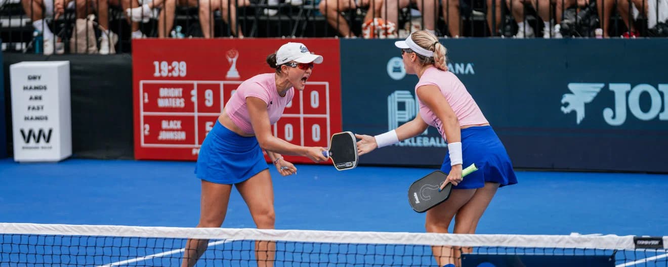 Anna Bright and Anna Leigh Waters celebrating a point during the women's doubles final at the Veolia Pickleball National Championships in Cary, NC.